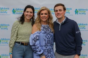 Leigh Anne Tuohy smiling with two fans