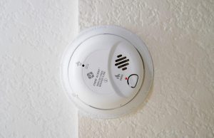 smoke alarm and carbon monoxide alarm on wall