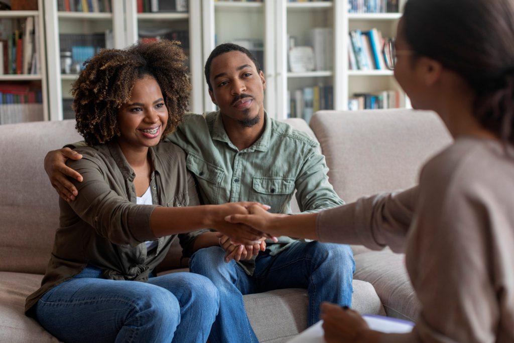 a couple receiving counseling for adoption training